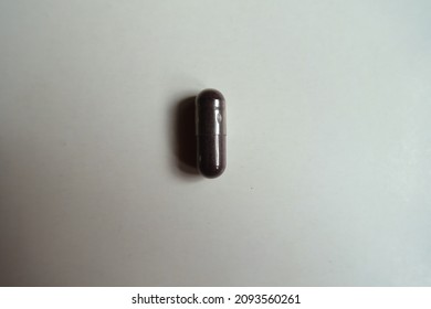 Dark Purple Capsule Of Bilberry Extract Dietary Supplement From Above