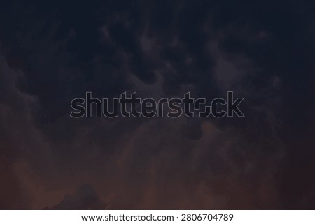 Dark, rain clouds on a summer evening, heralding a downpour.