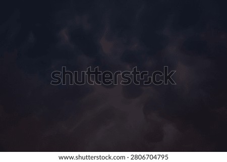 Dark, rain clouds on a summer evening, heralding a downpour.