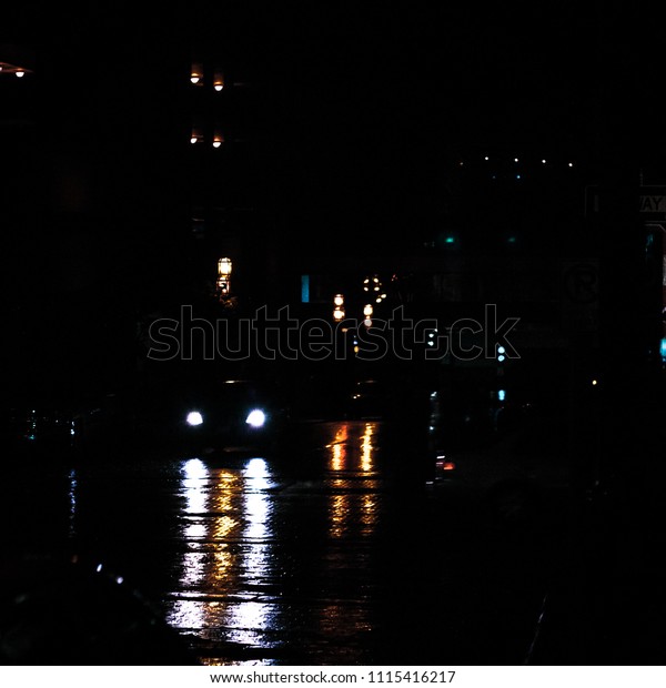 dark rainy reflection\
street lights