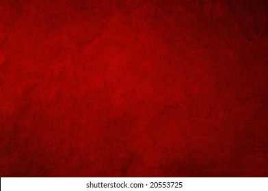 Dark red background fabric with soft folds and smudges in uneven candlelight. - Powered by Shutterstock