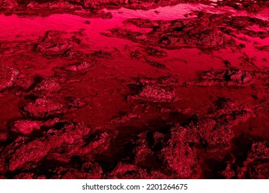 Dark red colored texture of volcanic coast