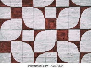 Dark red geometric abstract pattern on wood panel background