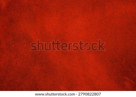 Dark red leather texture with smooth matte finish for upholstery and fashion design background