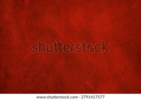 Dark red leather texture with smooth matte finish for upholstery and fashion design background