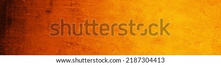 Dark red orange yellow texture. Gradient. Painted rough dirty concrete wall surface. Close-up. Background with space for design. Web banner. Wide. Panoramic. Spooky. Halloween.                       