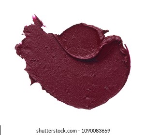 Dark red smear of matte lip gloss isolated on white background. Red creamy lipstick texture isolated on white background