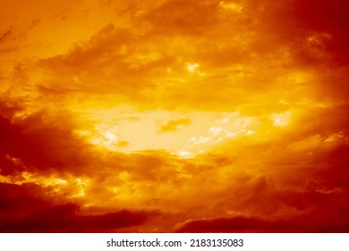  Dark red yellow orange sky with clouds. Gloomy dramatic skies. Background with space for design. Storm. Lightning fire.  Bright flash. Explosion in the sky. Horror, scary, creepy concept.             - Powered by Shutterstock