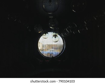 A dark room with a round window