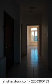 Dark Room Silhouette With Window With Cityscape In The Background