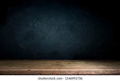 Dark room with tile floor and brick wall background