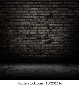 Dark room with tile floor and brick wall background - Shutterstock ID 130231616