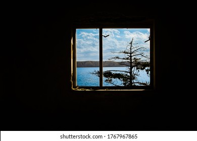 Dark room with a Window with a View on the Seaside