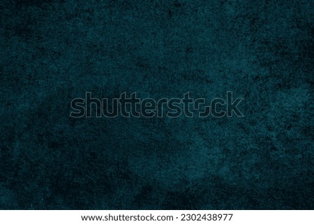 Dark rough surface with a bluish tint. Wall texture. Abstract dark background.