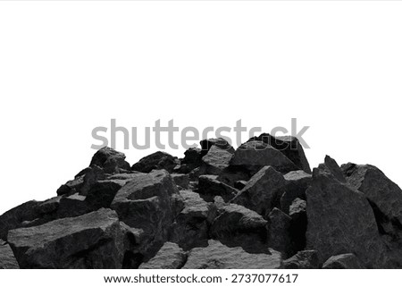 Dark, rugged, angular rocks form a sprawling pile in the lower frame, their textured surfaces sharply contrasting