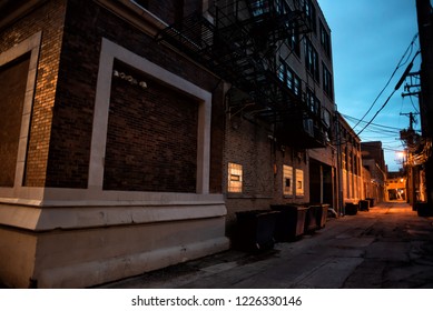 Dark And Scary Downtown Urban City Street Corner Alley With An E