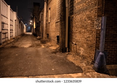 Dark And Scary Urban City Alley With A Vintage Brick A Wall At Night