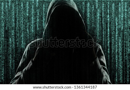 Dark silhouette of cyber criminal against background with digital symbols