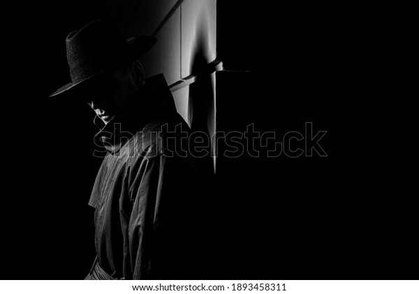 dark silhouette of a man in a\
raincoat with a hat at night on the street in a crime Noir\
style