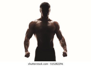Dark silhouette of a strong man body on white background. Confident young fitness man with strong hands and clenched fists. Bodybuilding Corporate Identity Branding Design Concept Clipping path inside