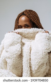 Dark Skin Girl In A White Fur Coat At A Photo Shoot