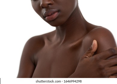 Dark skin model. Cropped photo of african woman standing against white background. Skin care. Beauty concept. Cosmetology concept