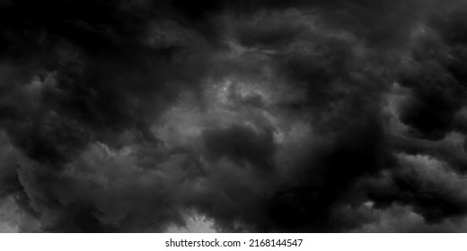 Dark Sky And Dramatic Black Cloud Before Rain.A Tropical Cyclone Is A Rapidly Rotating Storm System Characterized By A Low-pressure Center, A Closed Low-level Atmospheric Circulation, Strong Winds.