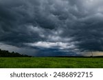 The Dark Sky with Heavy Clouds Converging and a Violent Storm. Bad or Moody Weather Sky and Environment. Global Warming, Climate Change