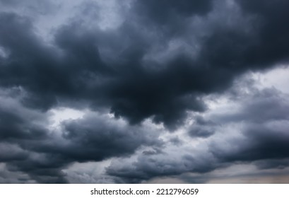 The Dark Sky With Heavy Clouds Converging And A Violent Storm Before The Rain.Bad Or Moody Weather Sky And Environment. Carbon Dioxide Emissions, Greenhouse Effect, Global Warming, Climate Change