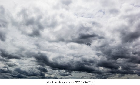 The Dark Sky With Heavy Clouds Converging And A Violent Storm Before The Rain.Bad Or Moody Weather Sky And Environment. Carbon Dioxide Emissions, Greenhouse Effect, Global Warming, Climate Change