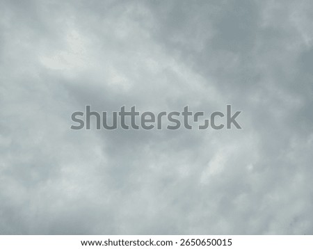 The dark sky with heavy clouds converging and a violent storm before the rain.Bad or moody weather sky and environment. carbon dioxide emissions, greenhouse effect, global war