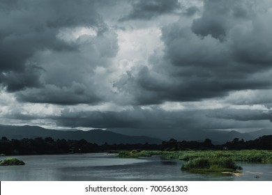 dark sky storm cloudy river landscape view - Powered by Shutterstock