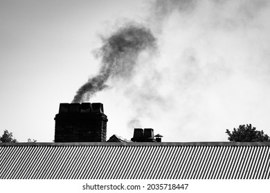 Dark Smoke Cloud From Chimney Smoke Stack In Black And White. Air Polution, Carbon Emissions, Climate Emergency, 