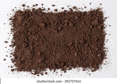 Dark Soil isolated on White Background. Pile of Dirt and Stones. Top View of a Heap of Ground. Close Up Macro View with Text or Image Space