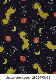 Dark space texture background with cute dinosaur astronauts pattern