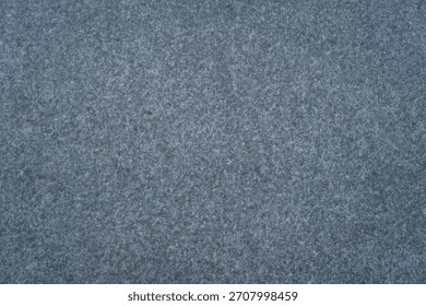 dark speckled gray surface background texture with fine granular pattern concept of acoustic paneling, textile design, stone products.