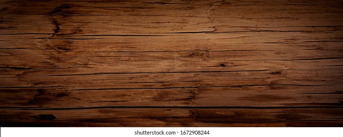 Dark Stained Reclaimed Wood Surface With Aged Boards Lined Up. Wooden Floor Planks With Grain And Texture.