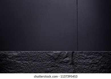 Dark Stone On Dark Wooden Table. Top View With Copy Space.