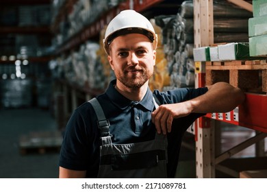 In Dark Store. Employee In Uniform Is Working In The Storage.