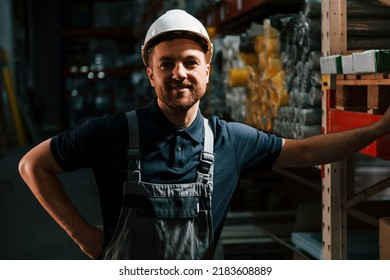 In Dark Store. Employee In Uniform Is Working In The Storage.