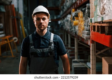 In Dark Store. Employee In Uniform Is Working In The Storage.