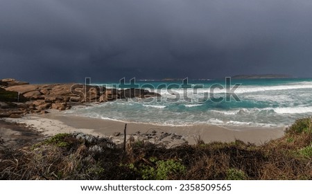 Dark storm clouds approaching small bay. Esperance Western Australia