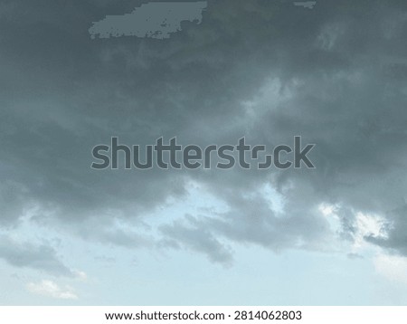 Dark Storm Clouds Gathering Across the Sky in a Natural Landscape