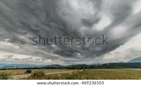 Similar – Foto Bild Stürme dunkle Wolken über dem Feld. Gewitter über einem Weizenfeld