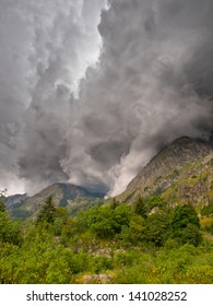 Dark Storm Clouds are Rolling in Over a Mountain Top
