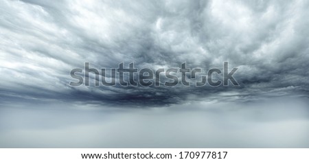 Dark storm clouds sky. Copy space below