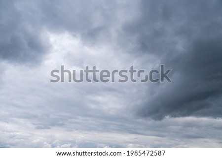 Dark storm clouds in the sky. Overcast sky before the rain. Dark gray dust clouds
