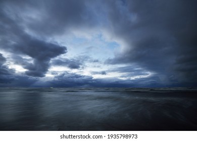 Dark Storm Sky Above The Baltic Sea, Waves And Water Splashes. Dramatic Cloudscape. Nature, Environment, Fickle Weather, Climate Change. Atmospheric Scenery. Panoramic View, Long Exposure