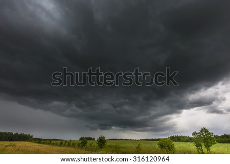 Similar – Foto Bild Stürme dunkle Wolken über dem Feld. Gewitter über einem Weizenfeld