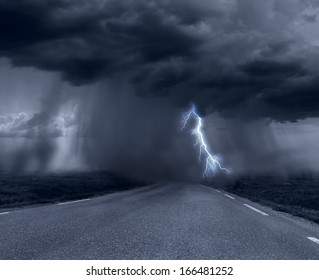 Dark Stormy Clouds Over Road